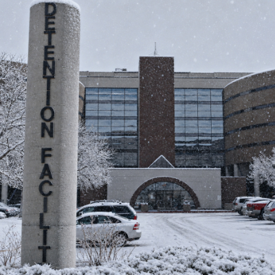 Snowy parking lot outside a jail