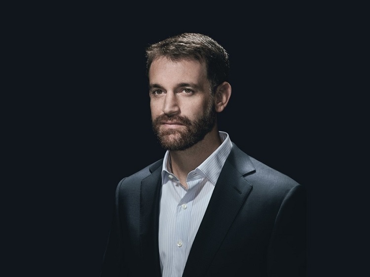 Professional headshot of John Arnold, CEO of controversial Arnold Foundation