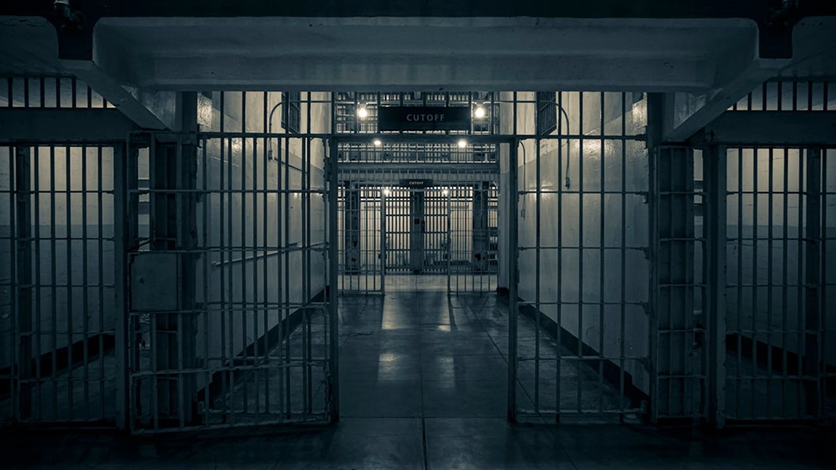 Interior of a prison with gated hallway entrance