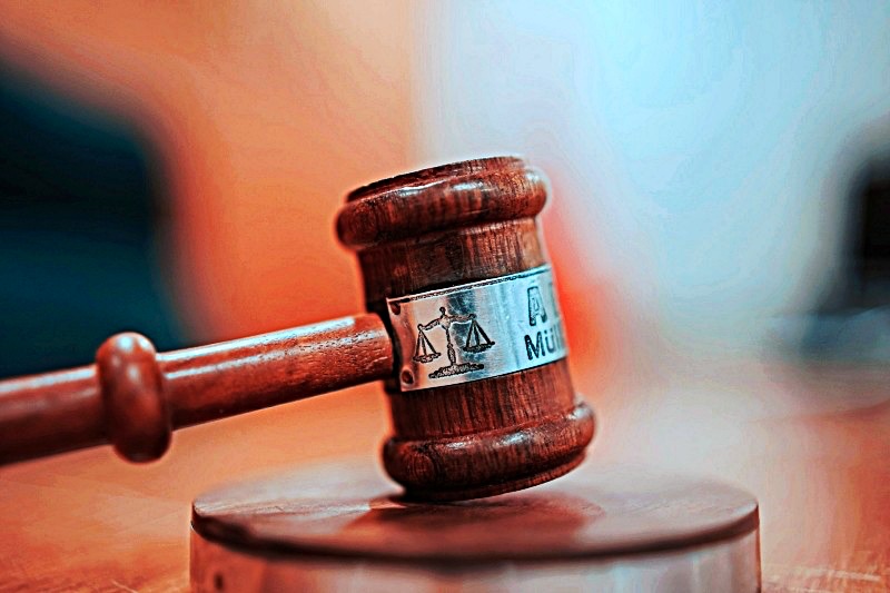 Wooden gavel on courtroom table