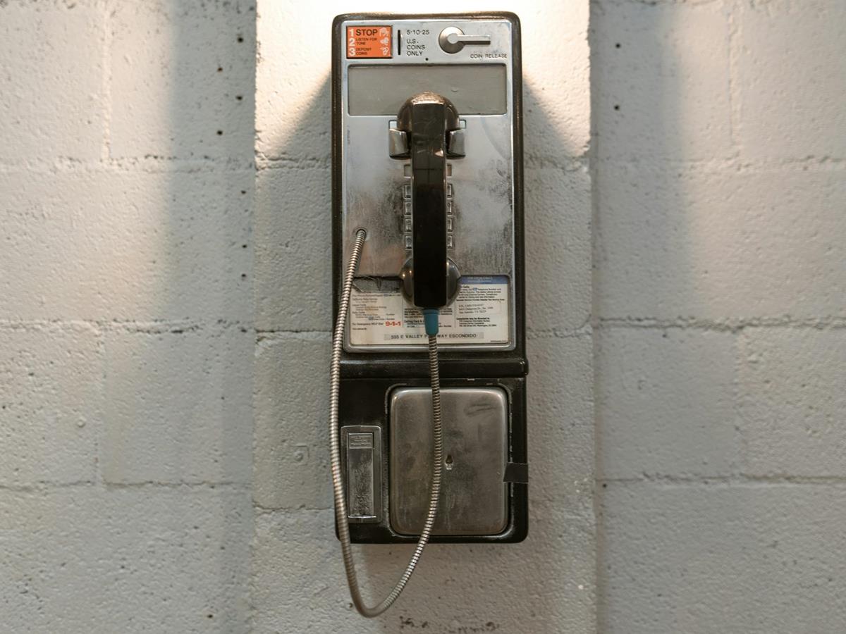 payphone mounted to the wall in jail