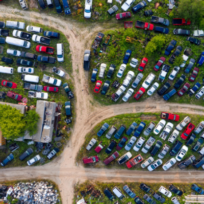 Cars parked closely together in an impound lot