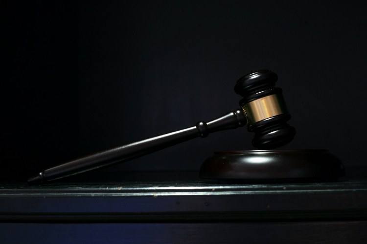 Mahogany wood gavel and block in dark room
